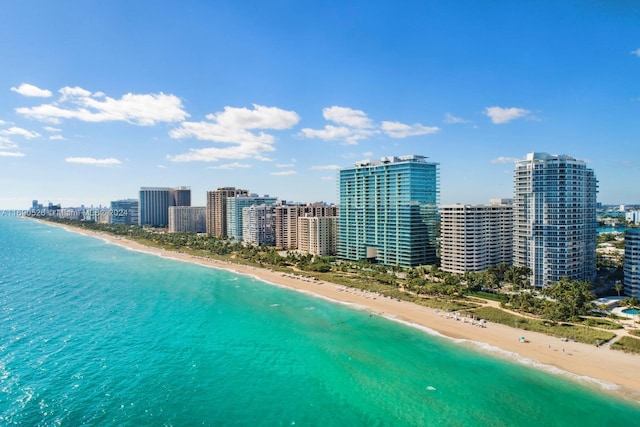 birds eye view of property with a view of the beach and a water view