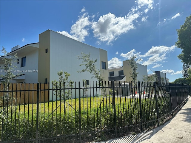 view of side of home featuring a yard