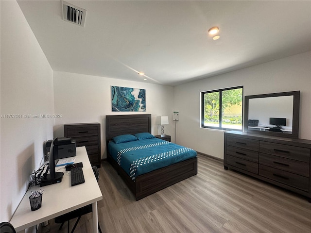 bedroom featuring wood-type flooring