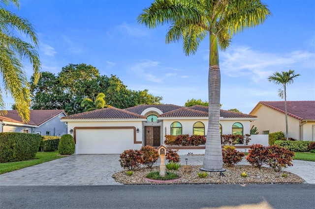 mediterranean / spanish-style house featuring a garage