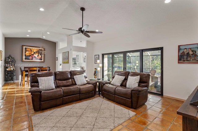 living room featuring ceiling fan, lofted ceiling, and french doors