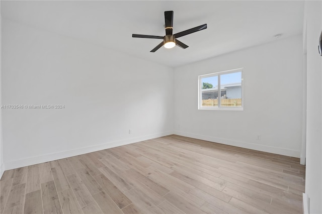 unfurnished room featuring ceiling fan and light wood-type flooring