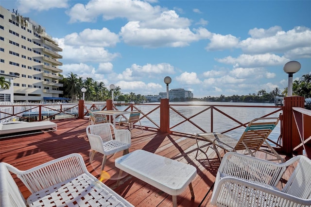 wooden terrace with a water view