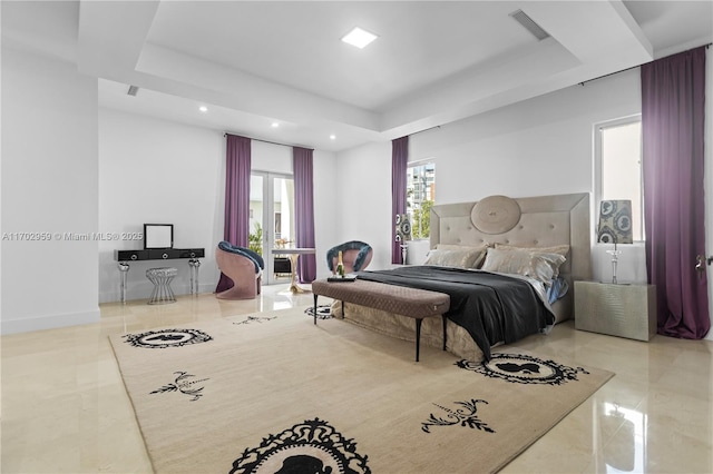 bedroom with a raised ceiling