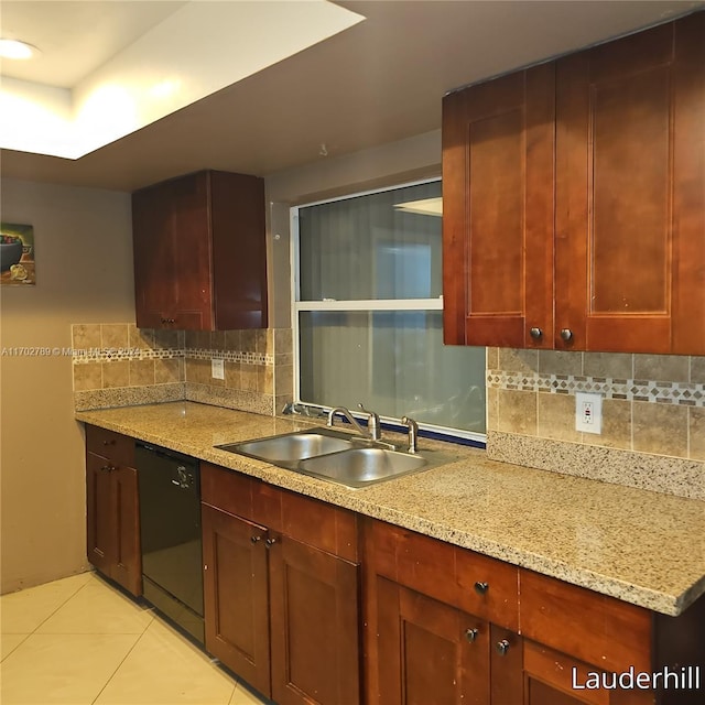 kitchen with light stone countertops, dishwasher, sink, tasteful backsplash, and light tile patterned flooring