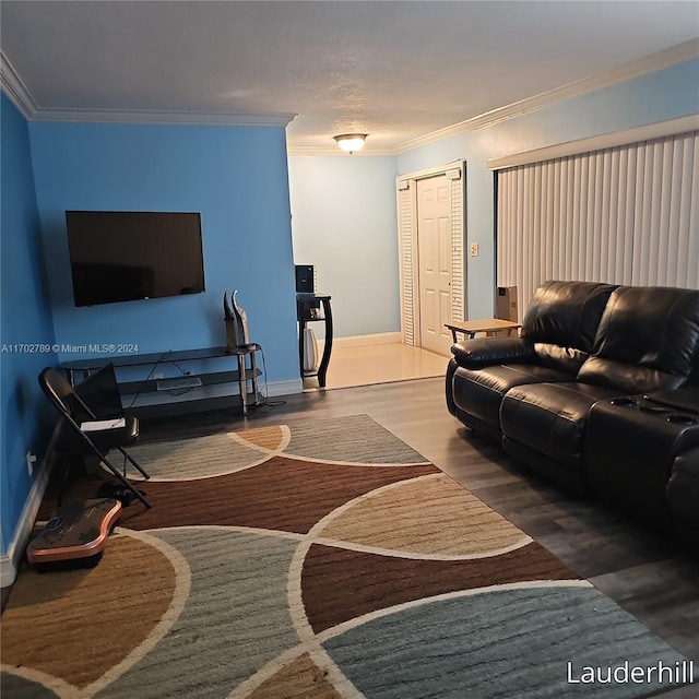 living room featuring hardwood / wood-style flooring, basketball court, and crown molding