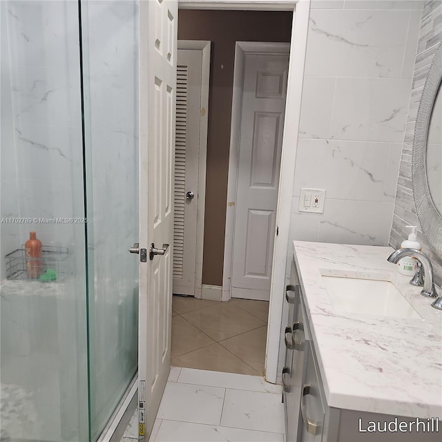 bathroom with vanity and an enclosed shower