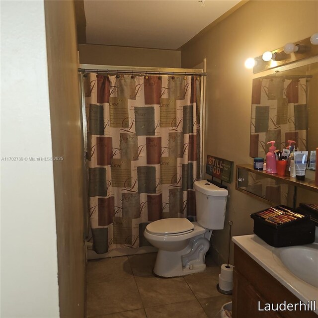 bathroom with tile patterned floors, vanity, toilet, and a shower with shower curtain