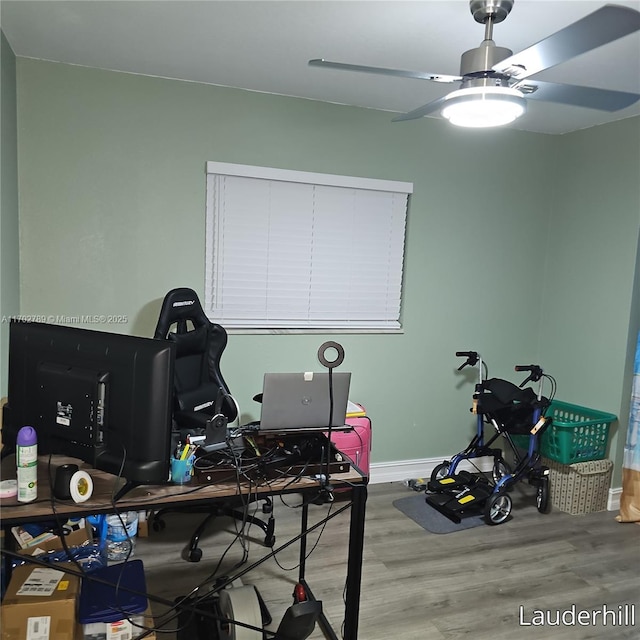 interior space with ceiling fan and hardwood / wood-style floors