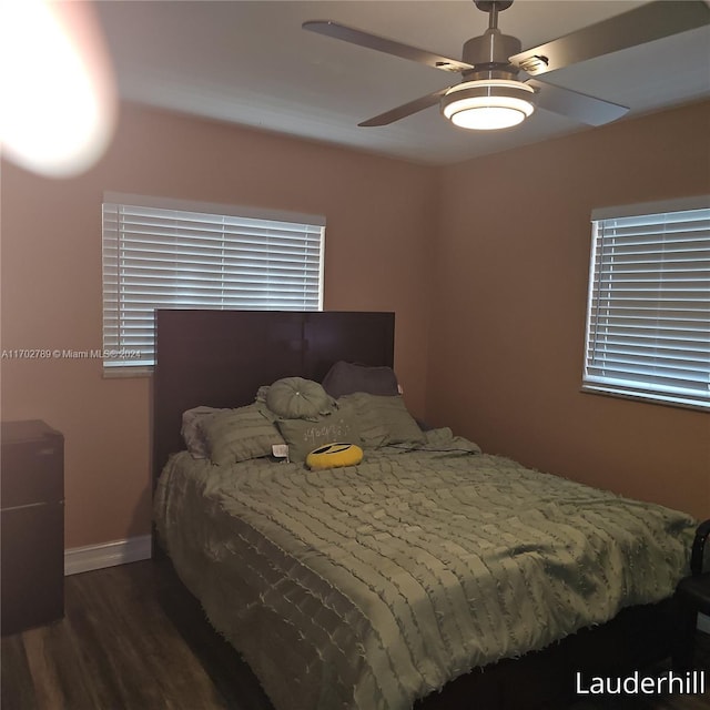 bedroom featuring ceiling fan and dark wood-type flooring