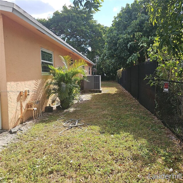 view of yard featuring central AC unit