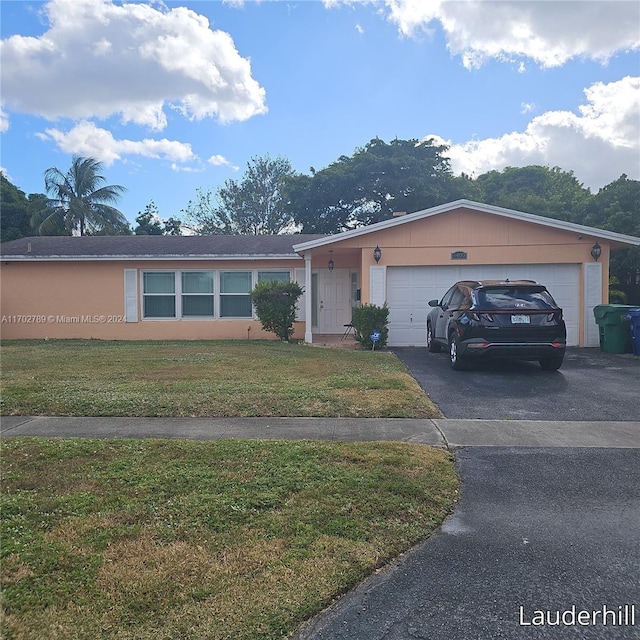 single story home with a garage and a front lawn