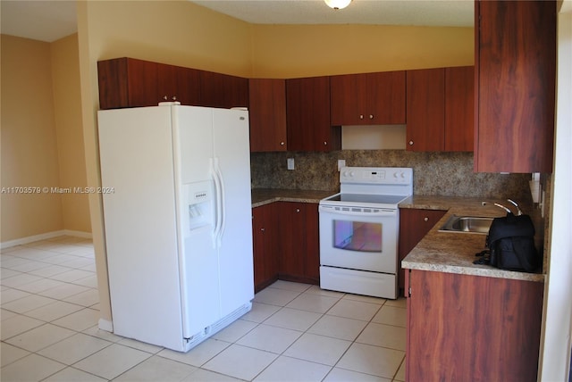 kitchen featuring white appliances, sink, vaulted ceiling, decorative backsplash, and light tile patterned floors