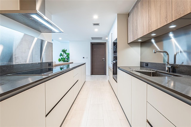 1000 Brickell Plz Unit 3806, Miami, FL 33131 - kitchen with wall chimney range hood, dark countertops, black appliances, modern cabinets, and recessed lighting