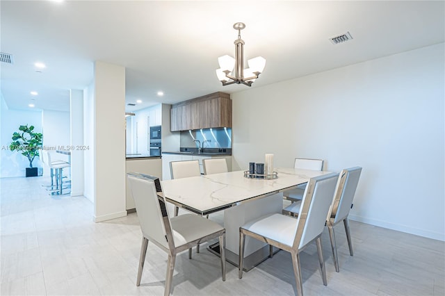 1000 Brickell Plz Unit 3806, Miami, FL 33131 - dining area featuring a chandelier and recessed lighting