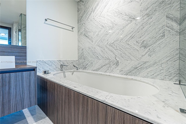 bathroom featuring a tub to relax in