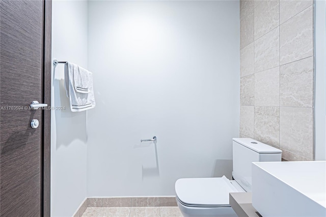 1000 Brickell Plz Unit 3806, Miami, FL 33131 - bathroom with vanity and tile walls