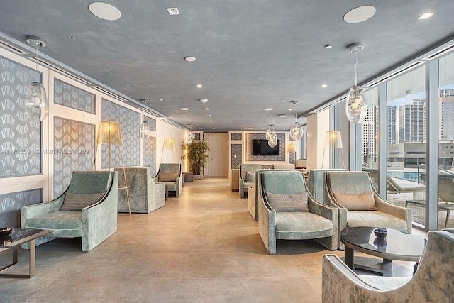 1000 Brickell Plz Unit 3806, Miami, FL 33131 - building lobby featuring a wall of windows and recessed lighting