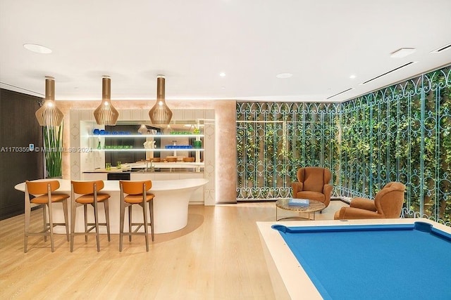 game room featuring pool table and light hardwood / wood-style flooring