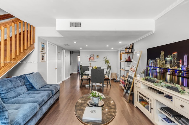 living room with ornamental molding and hardwood / wood-style flooring