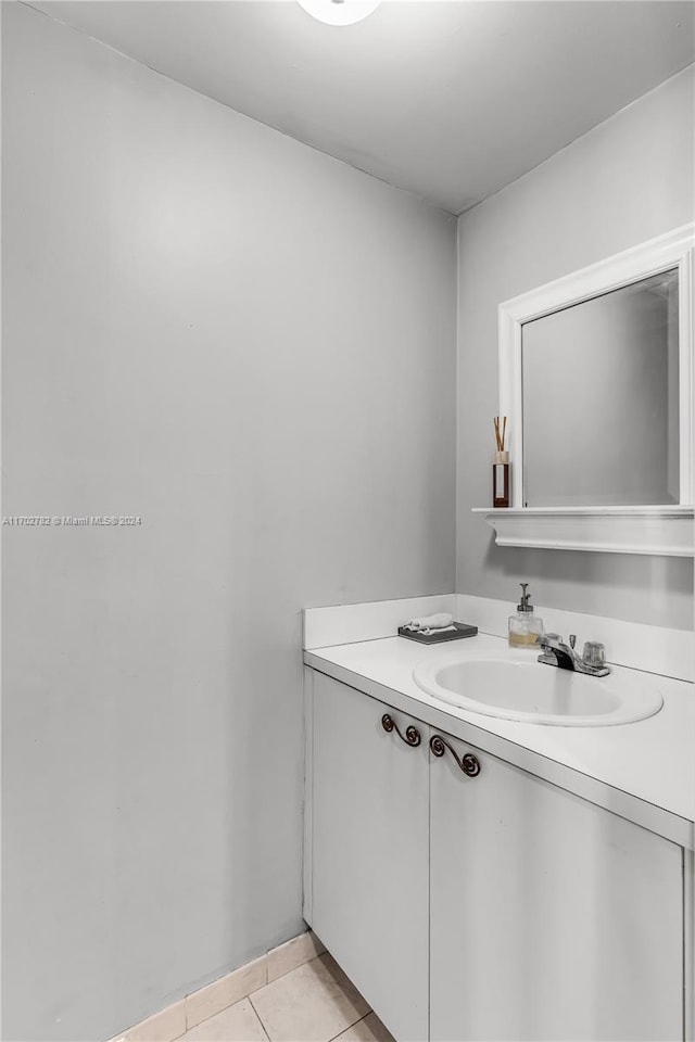 bathroom with tile patterned floors and vanity