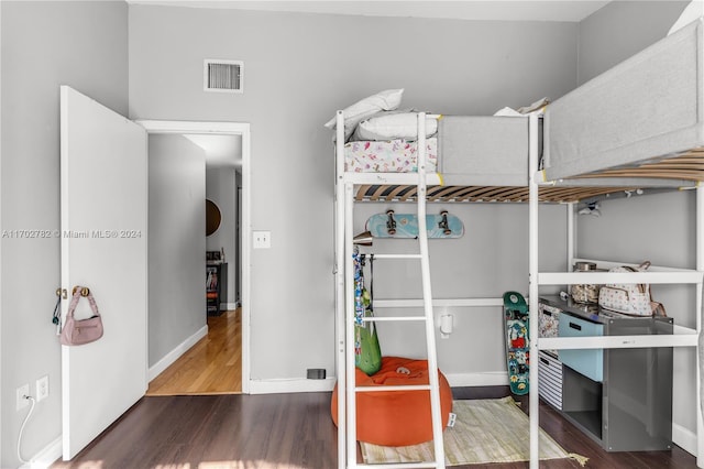 bedroom with hardwood / wood-style flooring