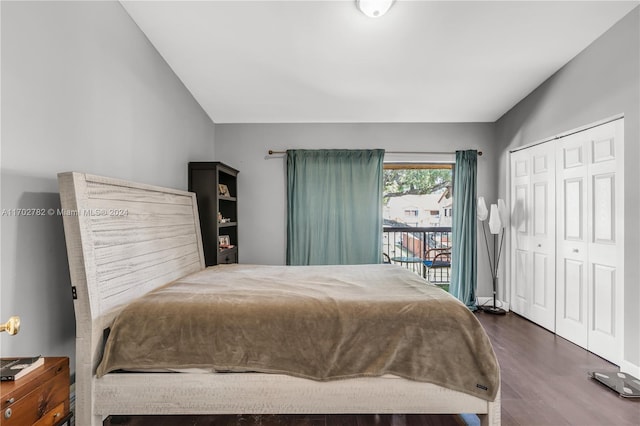 bedroom featuring access to exterior, dark wood-type flooring, and a closet