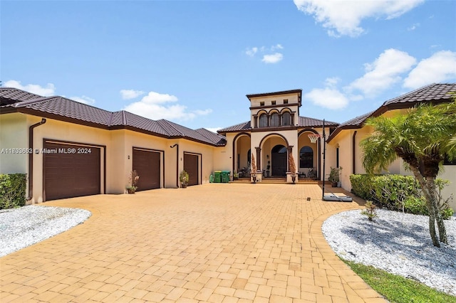 mediterranean / spanish-style house featuring a garage