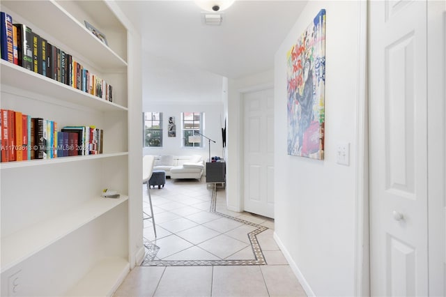 hallway featuring light tile patterned floors