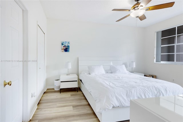 bedroom featuring light wood-type flooring and ceiling fan