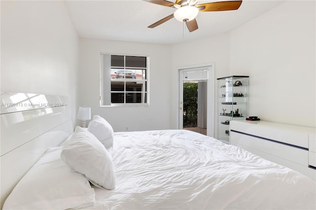 bedroom with ceiling fan and access to outside