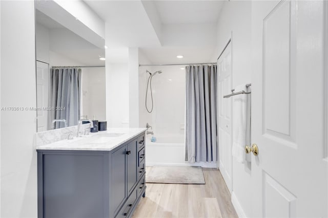 bathroom featuring shower / tub combo, vanity, and hardwood / wood-style flooring