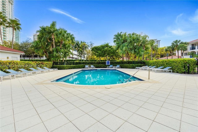 view of swimming pool featuring a patio