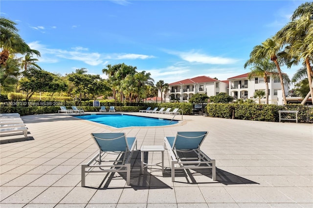 view of swimming pool with a patio area