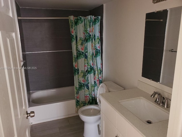 full bathroom with wood-type flooring, toilet, vanity, and shower / tub combo