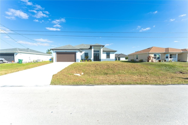 view of front of house with a garage and a front lawn