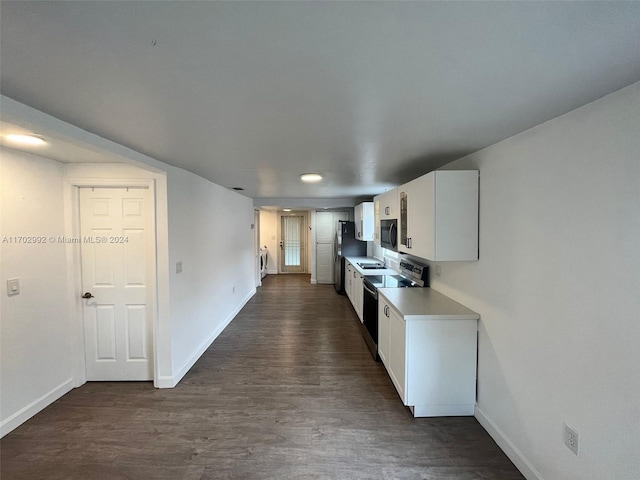 kitchen with white cabinetry, sink, dark hardwood / wood-style flooring, black electric range, and stainless steel fridge