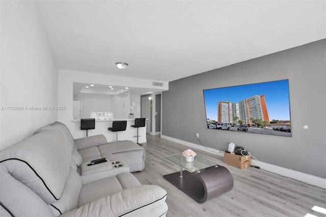 living room featuring light wood-type flooring