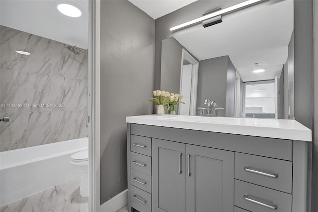 full bathroom with vanity, toilet, and tiled shower / bath