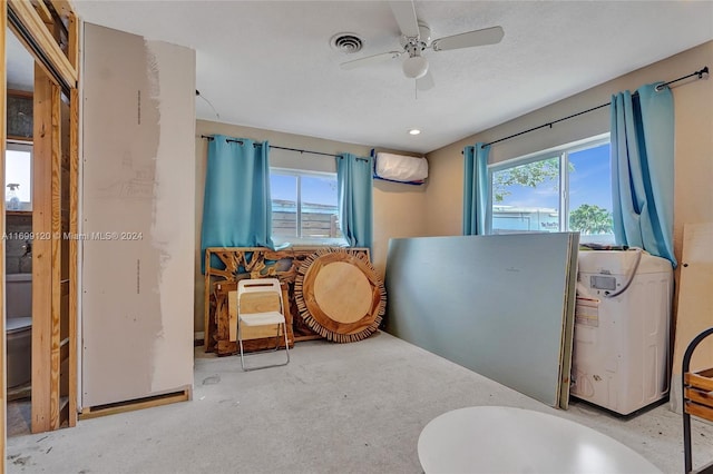 interior space with a wall mounted AC and ceiling fan