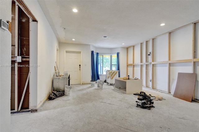 miscellaneous room with a textured ceiling