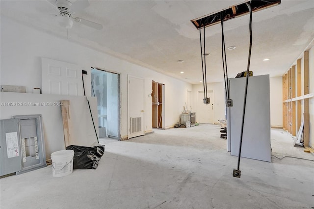 interior space with ceiling fan