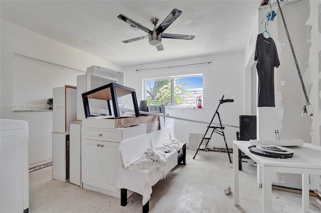 interior space featuring washer / clothes dryer and ceiling fan