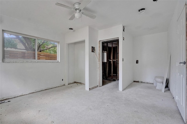 unfurnished room with ceiling fan