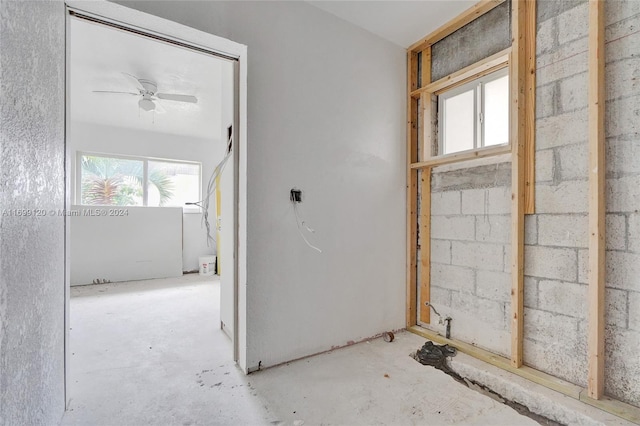 interior space featuring ceiling fan