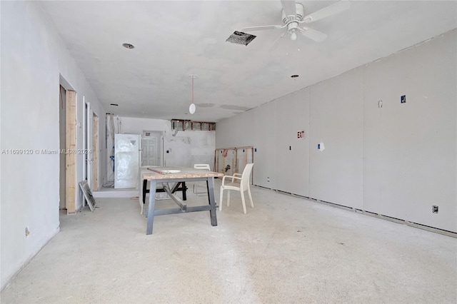 unfurnished dining area featuring ceiling fan