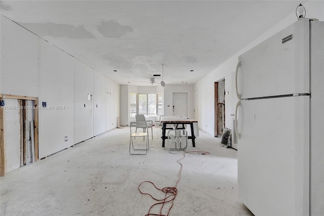 interior space featuring ceiling fan