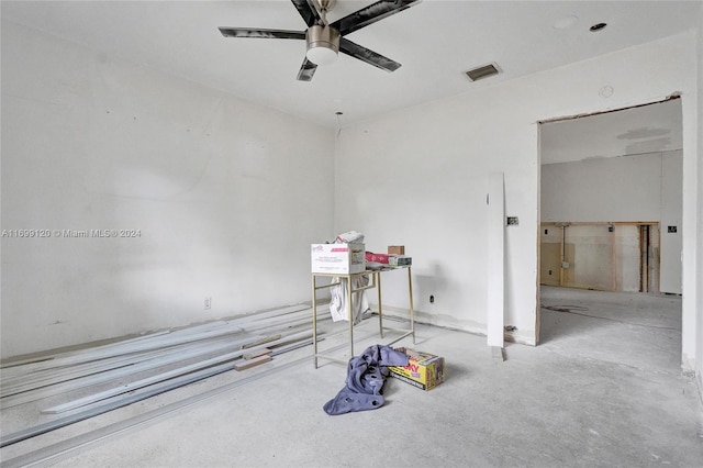 interior space with ceiling fan