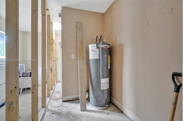 utility room featuring electric water heater