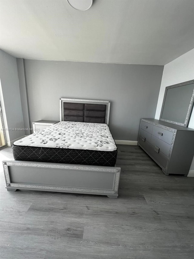 bedroom featuring wood-type flooring